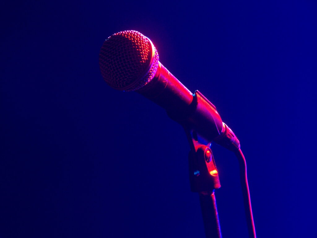 Corded microphone in ambient concert lighting